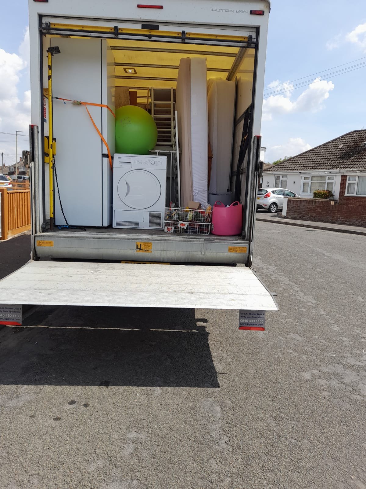 Removal van loaded with appliances and furniture, ready to move